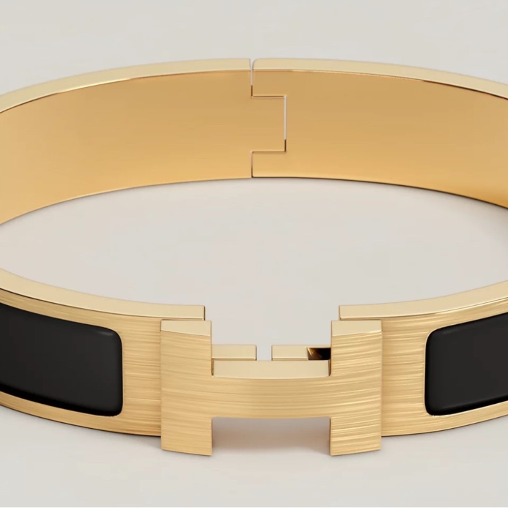 Hermes Men’s Gold and Black clickclack bracelet